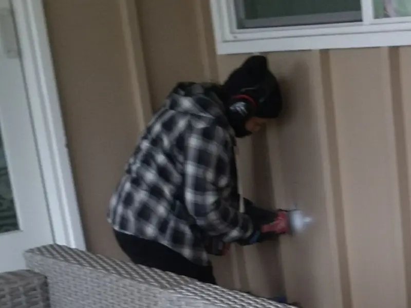 Professional electrician installing an exterior outlet in Pequea